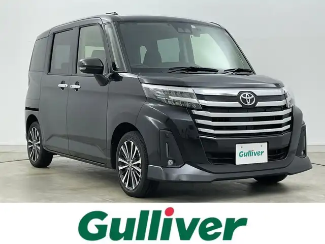 トヨタ ルーミー カスタムG－T 岡山県 2023(令5)年 1.8万km ブラックマイカメタリック 純正ナビ（NSZT-W68T）/【Bluetooth/フルセグTV/CD/DVD】/バックカメラ/両側電動スライドドア/追従型クルーズコントロール/コーナーセンサー（前/後）/衝突軽減ブレーキ/ビルトインＥＴＣ/ドライブレコーダー（前）/純正１５インチＡＷ/ＬＥＤヘッドライト/オートライト/フォグランプ/純正フロアマット/オートブレーキホールド/禁煙車/スマートキー