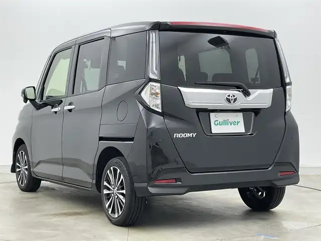トヨタ ルーミー カスタムG－T 岡山県 2023(令5)年 1.8万km ブラックマイカメタリック 純正ナビ（NSZT-W68T）/【Bluetooth/フルセグTV/CD/DVD】/バックカメラ/両側電動スライドドア/追従型クルーズコントロール/コーナーセンサー（前/後）/衝突軽減ブレーキ/ビルトインＥＴＣ/ドライブレコーダー（前）/純正１５インチＡＷ/ＬＥＤヘッドライト/オートライト/フォグランプ/純正フロアマット/オートブレーキホールド/禁煙車/スマートキー