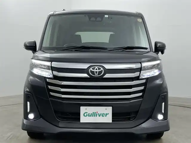 トヨタ ルーミー カスタムG－T 岡山県 2023(令5)年 1.8万km ブラックマイカメタリック 純正ナビ（NSZT-W68T）/【Bluetooth/フルセグTV/CD/DVD】/バックカメラ/両側電動スライドドア/追従型クルーズコントロール/コーナーセンサー（前/後）/衝突軽減ブレーキ/ビルトインＥＴＣ/ドライブレコーダー（前）/純正１５インチＡＷ/ＬＥＤヘッドライト/オートライト/フォグランプ/純正フロアマット/オートブレーキホールド/禁煙車/スマートキー