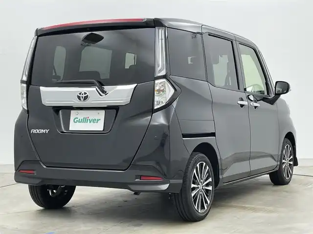 トヨタ ルーミー カスタムG－T 岡山県 2023(令5)年 1.8万km ブラックマイカメタリック 純正ナビ（NSZT-W68T）/【Bluetooth/フルセグTV/CD/DVD】/バックカメラ/両側電動スライドドア/追従型クルーズコントロール/コーナーセンサー（前/後）/衝突軽減ブレーキ/ビルトインＥＴＣ/ドライブレコーダー（前）/純正１５インチＡＷ/ＬＥＤヘッドライト/オートライト/フォグランプ/純正フロアマット/オートブレーキホールド/禁煙車/スマートキー