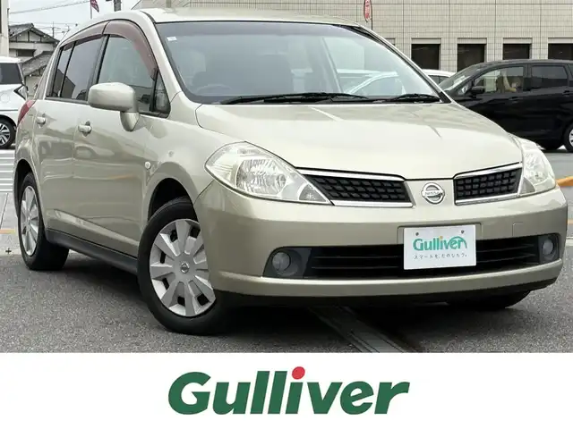 日産 ティーダ 15M+ナビプレミアムネクスト 三重県 2007(平19)年 8万km ウォームシルバー ♪ワンオーナー /インテリキー /スペアキー/純正ナビ/ドライブレコーダー/フォグライト/オートライト/電格ミラー/革巻ステアリング/ヘッドライトレベライザー/プライバシーガラス/フロアマット　/ドアバイザー