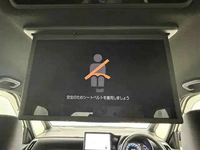 トヨタ ヴォクシー ハイブリッド S－Z 岡山県 2024(令6)年 2.5万km ホワイトパールクリスタルシャイン 純正10.5インチディスプレイオーディオ/「ナビ/CD/DVD/フルセグ/BT/HDMI/USB」/純正14インチフリップダウンモニター/型番:V14T-R72R/快適利便パッケージHigh/ミラー取付型デジタルインナーミラー/100V電源/バックカメラ/ブラインドスポットモニター/レーダークルーズコントロール/電動リアゲート/両側パワースライドドア/シートヒーター（1列目2列目）/ステアリングヒーター/オートハイビーム/LEDヘッドライト（AUTO機能付き）/ビルトインETC2.0/ドライブレコーダー（前後）/衝突軽減ブレーキシステム/横滑り防止装置/車線逸脱防止システム/コーナーセンサー（前後）/アイドリングストップ/スマートキー×2/取扱説明書/ナビ取扱説明書