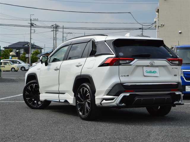 トヨタ ＲＡＶ４ ハイブリットG 栃木県 2020(令2)年 6.9万km ホワイトパールクリスタルシャイン モデリスタエアロ/・フロントスポイラー/・サイドスカート/・リヤスパッツ/モデリスタクールシャインキッド/・フロントグリルガーニッシュ/・ヘッドランプガーニッシュ/・バックドアガーニッシュ/TRD20インチアルミホイール［TRD TF X-Limited］/Toyota Safety Sense/・プリクラッシュセーフティ(歩行者[昼夜]・自転車運転/者[昼]検知機能付衝突回避支援タイプ／ミリ波レーダー＋単眼カメラ方式)/・レーントレーシングアシスト[LTA] /・レーダークルーズコントロール(全車速追従機能付)/・オートマチックハイビーム[AHB] /・ロードサインアシスト[RSA]/先行車発進告知機能[TMN]/インテリジェントクリアランスソナー[パーキングサポートブレーキ(静止物)]/リヤクロストラフィックオートブレーキ [パーキングサポートブレーキ(後方接近車両)]＋ブラインドスポットモニター[BSM]/純正9インチSDナビ［NSZT-Y68T］/・地デジ/・Bluetooth/・DVD/CD/SD/バックカメラ/運転席8ウェイパワーシート/快適温熱シート(運転席・助手席)/合皮シート/ハンズフリーパワーバックドア(挟み込み防止機能・停止位置メモリー機能付)/ETC