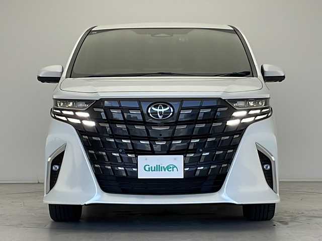 トヨタ アルファードハイブリット Z 愛知県 2024(令6)年 1.6万km プラチナホワイトパールマイカ 衝突軽減システム/純正14型ディズプレイオーディオ　ナビあり/フリップダウンモニター/三眼LEDヘッドライト/全方位カメラ/両側パワースライドドア/レーダークルーズコントロール/シートヒーター/エアシート/フルセグ/Bluetooth/バックカメラ/電動リアゲート/パワーシート/コーナーセンサー/純正アルミホイール/ETC2.0/ブラインドスポットモニター/ステアリングヒーター/リアオートエアコン/置くだけ充電機/ドライブレコーダー/ステアリングスイッチ/スマートキー/プッシュスタート