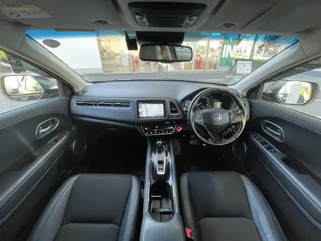 ホンダ ヴェゼル ハイブリッド Z ホンダセンシング 愛知県 2019(令1)年 16.6万km ミッドナイトブルービームM /ワンオーナー//禁煙車//純正ナビ・フルセグTV//Bluetooth・CD・DVD・AM・FM//スマートキー×２//保証書・取説//LEDフォグライト//カラードボディーロアーガーニッシュ//全ドアワンタッチ式パワーウインドウ//コンビシート＆専用インテリア//ラゲッジルームハードボード//運転席＆助手席シートヒーター//ルーフレール（FF）//パフォーマンスダンパー(R)//リバース連動ドアミラー（助手席側）//本革巻ステアリングホイール（スムースレザー）//雨滴検知式フロントワイパー//プラチナクロームメッキ加飾//17インチアルミホイール（スポーツタイプ）//エキパイフィニッシャー//自動防眩ルームミラー//前席用i-サイドエアバッグシステム＋サイドカーテンエアバッグシステム〈前席/後席対応〉//Honda SENSING//LEDヘッドライト〈インラインタイプ〉//左右独立温度コントロール式フルオート//エアコンディショナー//リアクティブフォースペダル//ハイブリッド専用デザインメーター//ナビ装着用スペシャルパッケージ＋ETC車載器//電子制御パーキングブレーキ//オートブレーキホールド機能