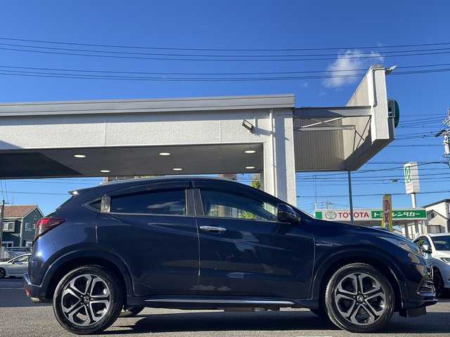 ホンダ ヴェゼル ハイブリッド Z ホンダセンシング 愛知県 2019(令1)年 16.6万km ミッドナイトブルービームM /ワンオーナー//禁煙車//純正ナビ・フルセグTV//Bluetooth・CD・DVD・AM・FM//スマートキー×２//保証書・取説//LEDフォグライト//カラードボディーロアーガーニッシュ//全ドアワンタッチ式パワーウインドウ//コンビシート＆専用インテリア//ラゲッジルームハードボード//運転席＆助手席シートヒーター//ルーフレール（FF）//パフォーマンスダンパー(R)//リバース連動ドアミラー（助手席側）//本革巻ステアリングホイール（スムースレザー）//雨滴検知式フロントワイパー//プラチナクロームメッキ加飾//17インチアルミホイール（スポーツタイプ）//エキパイフィニッシャー//自動防眩ルームミラー//前席用i-サイドエアバッグシステム＋サイドカーテンエアバッグシステム〈前席/後席対応〉//Honda SENSING//LEDヘッドライト〈インラインタイプ〉//左右独立温度コントロール式フルオート//エアコンディショナー//リアクティブフォースペダル//ハイブリッド専用デザインメーター//ナビ装着用スペシャルパッケージ＋ETC車載器//電子制御パーキングブレーキ//オートブレーキホールド機能