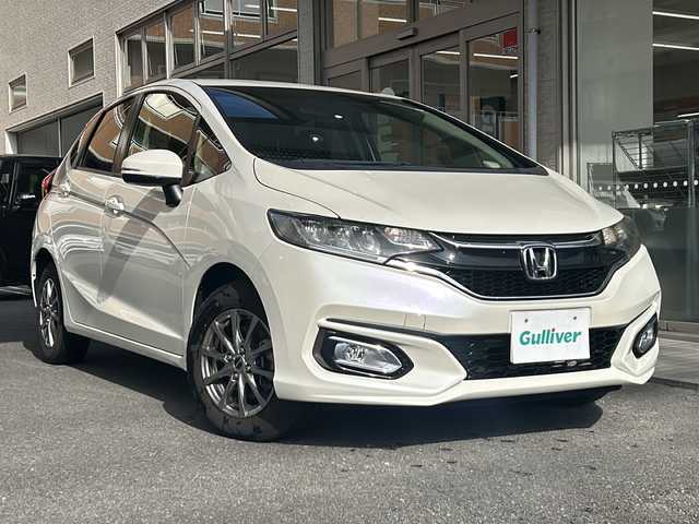 ホンダ フィット 13G F 高知県 2017(平29)年 3.7万km プレミアムホワイトパールⅡ 社外７インチナビ/（フルセグＴＶ／Ｂｌｕｅｔｏｏｔｈオーディオ／ＣＤ・ＤＶＤ）/ＥＴＣ/ＬＥＤヘッドライト/オートライト/純正フロアマット/社外アルミホイール/スマートキー/スペアキー