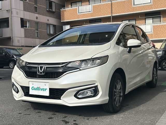 ホンダ フィット 13G F 高知県 2017(平29)年 3.7万km プレミアムホワイトパールⅡ 社外７インチナビ/（フルセグＴＶ／Ｂｌｕｅｔｏｏｔｈオーディオ／ＣＤ・ＤＶＤ）/ＥＴＣ/ＬＥＤヘッドライト/オートライト/純正フロアマット/社外アルミホイール/スマートキー/スペアキー