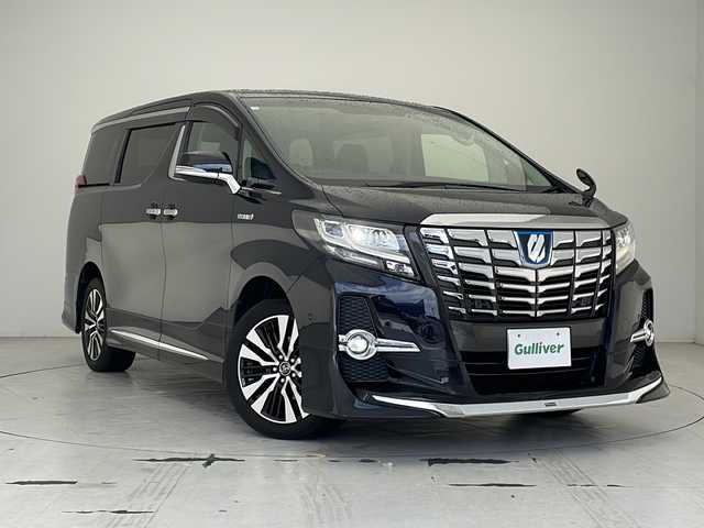 トヨタ アルファードハイブリット SR Cパッケージ 沖縄県 2016(平28)年 7.9万km スパークリングブラックパールクリスタルシャイン 9.2型ナビ＋JBLプレミアムサウンドシステム/Blu-ray/DVD/CD/SD/AM/FM/USB/AUX/フルセグ/バックカメラ/リヤエンターテインメントシステム/モデリスタフルエアロ/両側パワースライドドア/パワーバックドア/クルーズコントロール/クリアランスソナー/パーキングアシスト/オートマチックハイビーム/アクセサリーコンセント（AC100V・1500W）/レザーシート/1・2列目パワーシート/前席シートヒーター/ステアリングヒーター/LEDヘッドライト/オートライト/純正18インチAW/純正フロアマット/プッシュスタート/スマートキ―/寒冷地仕様