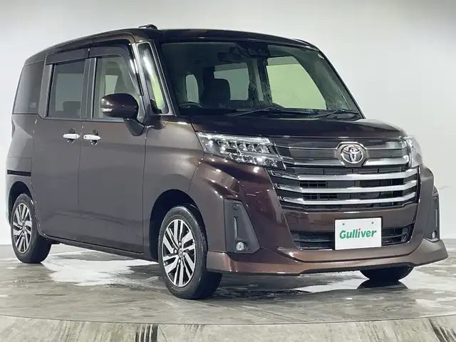 トヨタ ルーミー カスタムG 福岡県 2022(令4)年 1.1万km プラムブラウンパールクリスタルシャイン プッシュスタート/両側パワースライドドア/アイドリングストップ/オートブレーキホールド/純正LEDヘッドライト/シートヒーター/ドアバイザー/フォグランプ/保証書/スペアキー