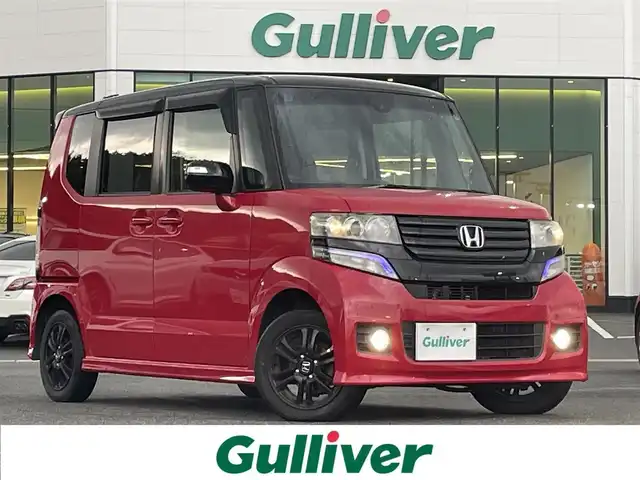 ホンダ Ｎ ＢＯＸ カスタム G Aパッケージ 島根県 2014(平26)年 6.7万km ミラノレッド 登録時走行距離　67011km/ワンオーナ/取扱説明書/保証書/純正ナビ(VXM-145VSi）/（Bluetooth/AM/FM/CD/DVD/USB）/ワンセグテレビ/バックカメラ/プッシュスタート/スマートキー/スペアキー/純正フロアマット/横滑り防止装置/衝突軽減システム/カーテンエアバック/純正アルミ１４インチ/禁煙車