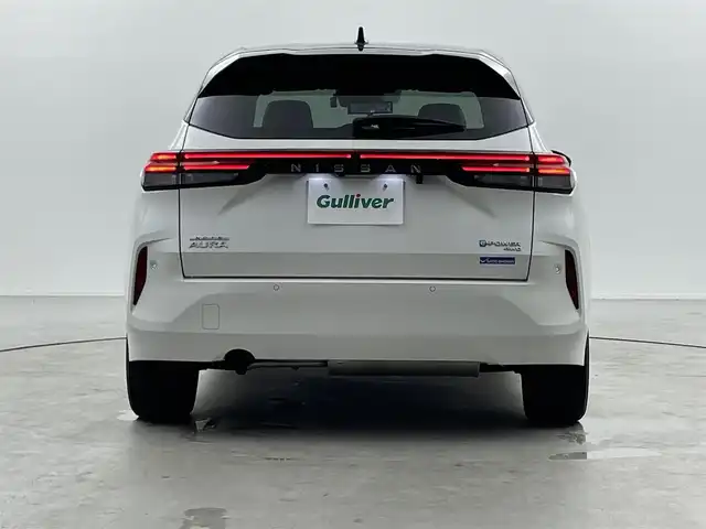 日産 オーラ G FOUR レザーエディション 福井県 2022(令4)年 2.6万km ピュアホワイトパール / スーパーブラック 2トーン BOSEサウンドシステム/純正ナビ/【フルセグ/AM/FM/Bluetooth】/全方位支援システム/アラウンドビューモニター/インテリジェントルームミラー/インテリジェントエマージェンシーブレーキ/プロパイロット/標識検知支援/ルート減速支援/ステアリングヒーター/ビルトインETC2.0/クルーズコントロール/純正アルミホイール１７インチ/前方ドライブレコーダー/純正フロアマット
