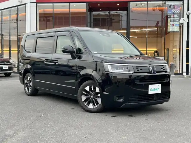 ホンダ ステップワゴン eHEV エアー 宮城県 2022(令4)年 5.2万km クリスタルブラックパール 登録時走行距離51970km/純正ナビ/FM・AM・TV・Bluetooth/両側パワースライドドア/バックカメラ/衝突軽減システム/レーンキープアシスト/クルーズコントロール（追従走行あり）/コーナーセンサー（前後）/プッシュスタート/LED/ビルトインETC/純正アルミホイール/純正フロアマット/後席スモーク/電子制御シフト/ヘッドライトレベライザー/ドアバイザー/ウインカーミラー