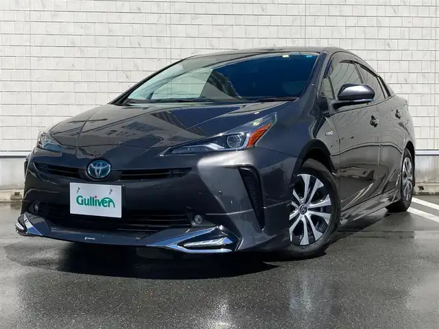 トヨタ プリウス A 静岡県 2019(令1)年 4.4万km グレーメタリック Toyota Safety Sense/社外SDナビ(CN-RE05D)/　AM FM CD DVD Bluetooth/フルセグTV/バックモニター/ビルトインETC/LEDオートヘッドランプ/モデリスタエアロ/パワーシート(運転席)/レーダークルーズコントロール/ヘッドアップディスプレイ/前後方クリアランスソナー/純正15インチアルミホイール/スマートキー2本/プッシュスタート/ドライブモードセレクト