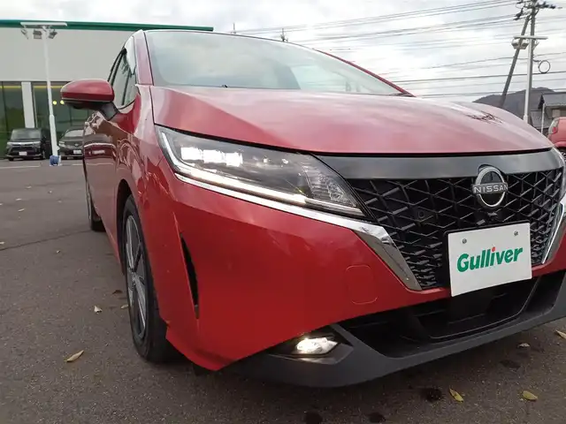 日産 ノート X 福井県 2022(令4)年 2万km ガーネットレッド 純正9インチナビ/AM/FM/フルセグ/BT/CD/DVD/USB/iPod/全方位カメラ/エマージェンシーブレーキ/前後コーナーセンサー/レーンキープアシスト/横滑り防止装置/盗難防止装置/アイドリングストップ/前方ドライブレコーダー/ETC/デジタルインナーミラー/革調シートカバー/純正フロアマット/LEDヘッドライト/オートホールド/スマートキー