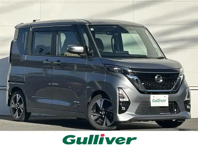 日産 ルークス HWS Gターボ プロパイロットED 佐賀県 2021(令3)年 5.6万km チタニウムグレーメタリック 内装：茶基調/プロパイロット/エマージェンシーブレーキ/インテリジェントクルーズコントロール/ソナー/純正9インチナビ/・アラウンドビューモニター/・フルセグTV/BT/CD/DVD/純正ドライブレコーダー(DJ4-D)/純正15インチAW/ハーフレザーシート/LEDヘッドライト/フォグランプ/オートライト/電動パーキングスイッチ/プッシュスタート/リアサーキュレーター