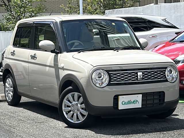 スズキ ラパン X 埼玉県 2022(令4)年 0.9万km フォーンベージュM 走行距離8394km/ワンオーナー/純正8インチナビ(CN-RZ876)/AM/FM/BT/CD/DVD/フルセグTV/アランドビューモニター/シートヒーター（D+N席）/前後ドライブレコーダー/ビルトインETC/ステアリングリモコン/純正14インチアルミホイール/スズキセーフティーアシスト/レーンキープアシスト/衝突被害軽減システム/バックセンサー/横滑り防止装置/アイドリングストップ/先行車発進お知らせ機能/標識認識機能/オートライト/LEDヘッドライト/プッシュスタート/スマートキー×2/電動格納ミラー/純正フロアマット/純正ドアバイザー/保証書/取扱説明書/ナビ取扱説明書