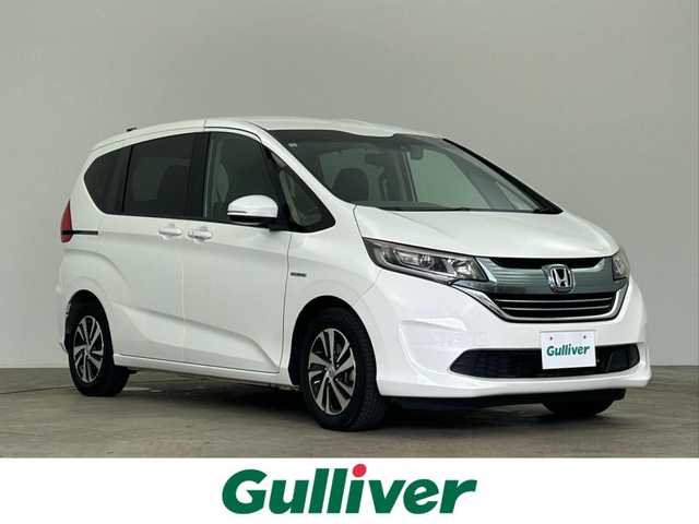 ホンダ フリード ハイブリット EX 千葉県 2016(平28)年 7.7万km ホワイトオーキッドパール 禁煙　/両側電動スライドドア　/シートヒーター　/ＬＥＤヘッドライト/ホンダセンシング/レーダークルーズコントロール　/社外７型ナビ（MDV-D403）/Ｃパッケージ　/Ｓパッケージ　/コンフォートビューパッケージ　/ビルトインＥＴＣ/ワンセグＴＶ　/バックカメラ/カーテンエアバック/リアサンシェード/電動格納サイドミラー/2列目キャプテンシート/アイドリングストップ/ウィンカーミラー/プッシュスタート