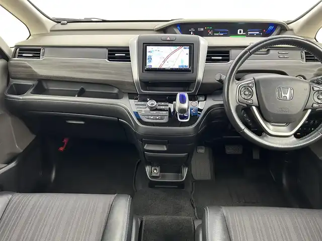 ホンダ フリード ハイブリット EX 千葉県 2016(平28)年 7.7万km ホワイトオーキッドパール 禁煙　/両側電動スライドドア　/シートヒーター　/ＬＥＤヘッドライト/ホンダセンシング/レーダークルーズコントロール　/社外７型ナビ（MDV-D403）/Ｃパッケージ　/Ｓパッケージ　/コンフォートビューパッケージ　/ビルトインＥＴＣ/ワンセグＴＶ　/バックカメラ/カーテンエアバック/リアサンシェード/電動格納サイドミラー/2列目キャプテンシート/アイドリングストップ/ウィンカーミラー/プッシュスタート