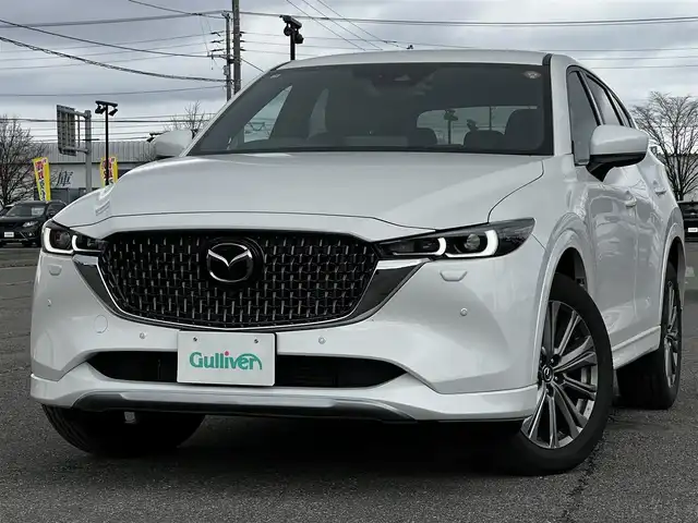 マツダ ＣＸ－５ XD エクスクルーシブモード 道央・札幌 2025(令7)年 1万km ロジウムホワイトプレミアムメタリック ４WD/ワンオーナー/BOSEサウンド/純正メモリーナビ/AM/FM/BT/フルセグ/衝突被害軽減ブレーキ/レーダークルーズコントロール/横滑り防止装置/レーンキープアシスト/クリアランスソナー/ブラインドスポットモニター/バックカメラ/サイドカメラ/フロントカメラ/全方位カメラ/アラウンドビューモニター/ETC/ドライブレコーダー/アイドリングストップ/パワーバックドア/前席パワーシート/D席メモリーシート/全席シートヒーター/前席エアシート/レザーシート/革巻きステアリング/ステアリングリモコン/パドルシフト/ハンドルヒーター/電動パーキング/オートブレーキホールド/自動防眩ミラー/MTモード付AT/プッシュスタート/スマートキー/LEDヘッドライト/オートライト/オートマチックハイビーム/電動格納ミラー/ウィンカーミラー/純正フロアマット/スペアキー/純正エンジンスターター