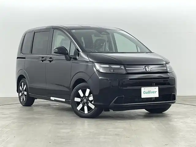 ホンダ フリード ハイブリット 福島県 2025(令7)年 0.1千km クリスタルブラックパール ホンダセンシング/・衝突軽減ブレーキ/・アダプティブクルーズコントロール/・先行車発進お知らせ/・歩行者事故低減ステアリング/・レーンキープアシスト/・標識認識機能/・トラフィックジャムアシスト/・BSM/・誤発進抑制/・後方誤発進抑制/・急アクセル抑制/・パーキングセンサー/純正9インチメモリーナビ/型式：LXM-242ZFNi/・フルセグTV/・Bluetooth/・FM/AM/・AppleCarPlay/・androidオート/・ステアリングスイッチ/・USB/両側パワースライドドア/LEDヘッドライト/・オートライト/・オートマチックハイビーム/前席シートヒーター/純正15インチホイール/サーキュレーター/プッシュスタート/・スマートキー/・スペアキー