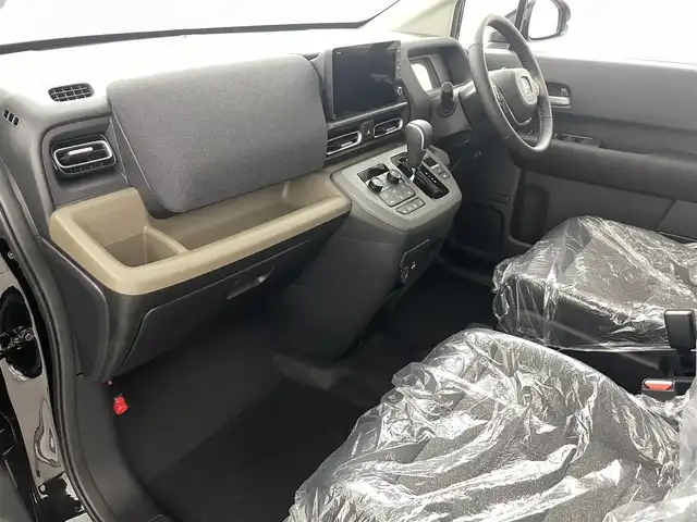 ホンダ フリード ハイブリット 福島県 2025(令7)年 0.1千km クリスタルブラックパール ホンダセンシング/・衝突軽減ブレーキ/・アダプティブクルーズコントロール/・先行車発進お知らせ/・歩行者事故低減ステアリング/・レーンキープアシスト/・標識認識機能/・トラフィックジャムアシスト/・BSM/・誤発進抑制/・後方誤発進抑制/・急アクセル抑制/・パーキングセンサー/純正9インチメモリーナビ/型式：LXM-242ZFNi/・フルセグTV/・Bluetooth/・FM/AM/・AppleCarPlay/・androidオート/・ステアリングスイッチ/・USB/両側パワースライドドア/LEDヘッドライト/・オートライト/・オートマチックハイビーム/前席シートヒーター/純正15インチホイール/サーキュレーター/プッシュスタート/・スマートキー/・スペアキー