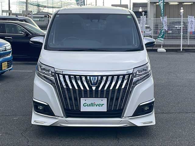 トヨタ エスクァイア ハイブリッド Gi プレミアムパッケージ 愛知県 2017(平29)年 7万km ホワイトパールクリスタルシャイン /禁煙/ワンオーナー//ディーラー整備記録簿/H30.R1.2.3.4.5.6//純正10インチナビ/フルセグ/CD/DVD/SD/MSV//HDMI/USB/バックカメラ/ビルトインETC//ドライブレコーダー/純正12インチフリップダウンモニタ//両側パワースライドドア//茶ハーフレザーシート/シートヒーター//コンビステア/ステアリングスイッチ/ステアヒーター//純正LEDオートライト/オートハイビーム//純正LEDフォグ//リアロールサンシェード//オートリトタウインカーミラー//フロント・リアエアロ//GPSレーダー探知機//アルパインツィーター//ドライブサポートイルミネーション//PCS/LDA/クルーズコントロール//自動防眩ルームミラー//照明付きバニティミラー//純正15インチAW//新車時保証書//取扱説明書//スペアスマートキー