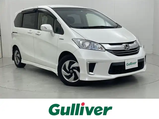 ホンダ フリード ハイブリット プレミアムエディション 茨城県 2016(平28)年 6.8万km ホワイトオーキッドパール 純正ナビ［VXM-165VFi］/フルセグ再生可/バックカメラ/ハーフレザーシート/両側パワースライドドア/純正フロアマット/ビルトインETC/ドライブレコーダー（前のみ）