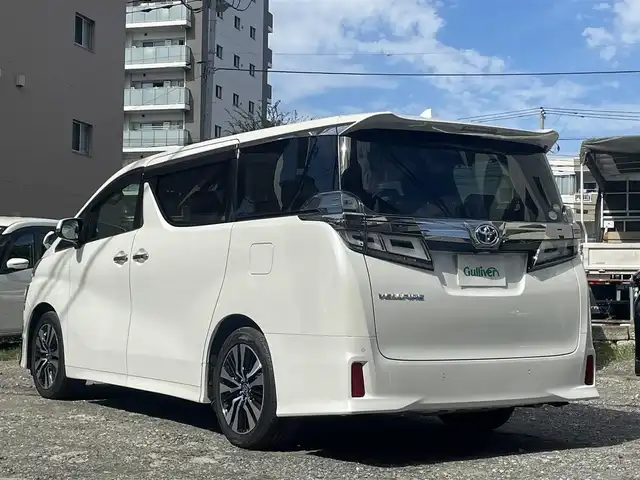 トヨタ ヴェルファイア Z Gエディション 東京都 2019(令1)年 4.4万km ホワイトパールクリスタルシャイン 純正SDナビ/ (フルセグTV/Bluetooth/DVD/SD)/バックカメラ/ビルトインETC2.0/前後ドライブレコーダー/両側パワースライドドア/デジタルインナーミラー/レザーシート/前席パワーシート【運転席メモリ機能あり】/前席シートヒーター/エアシート/オットマンシート/3列シート/パワーバックドア/ステアリングヒーター/TOYOTA Safety Sense/・レーダークルーズ コントロール/・プリクラッシュセーフティ/・レーントレーシングアシスト/・レーンディパーチャーアラート/・ロードサインアシスト/・先行車発進告知機能/・オートマチックハイビーム/ブラインドスポットモニター/横滑り防止装置/スマートキー/純正18インチアルミホイール/純正LEDヘッドライト/カーテンエアバック/スペアキー1本/保証書/取扱説明書