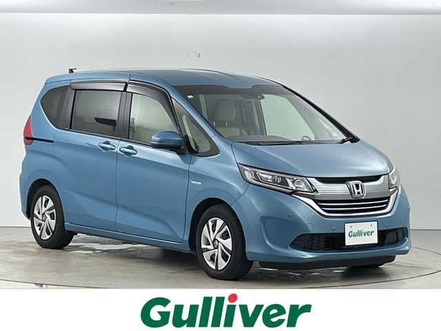 ホンダ フリード ハイブリット G ホンダセンシング 愛知県 2016(平28)年 7.9万km ブルーホライゾンM 禁煙車/純正7インチナビ/（CD/DVD/Bluetooth/フルセグTV）/バックカメラ/AC100V電源/ホンダセンシング/・衝突軽減ブレーキ/・レーダークルーズコントロール/・レーンキープアシスト/・パーキングセンサー/ドライブレコーダー/ETC/両側パワースライドドア/スマートキー/スペアキー有/プッシュスタート/純正フロアマット/LEDヘッドライト/横滑り防止装置
