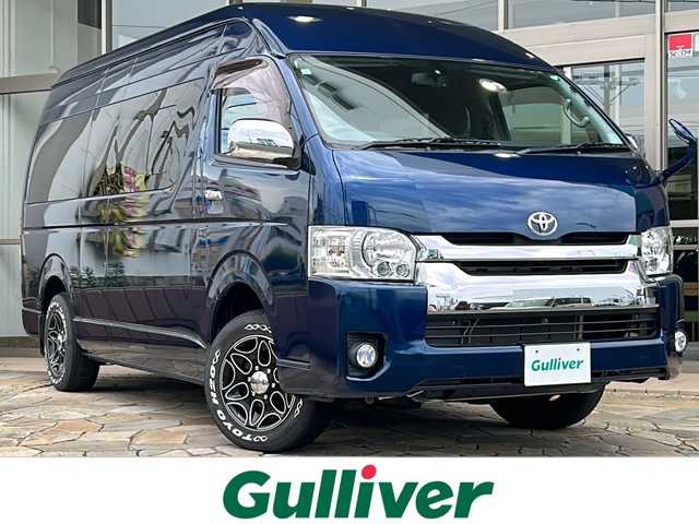 トヨタ ハイエース グランドキャビン 静岡県 2015(平27)年 2.3万km ダークブルーマイカM 社外ナビ(イクリプス)/・TV/・FM/AM/・Bluetooth/・CD/DVD/・SD/・USB/主要装備/・ＭＧＲベッドキット/・後付けハンガーラック/・後付けリアオートエアコン/・TOYOホワイトレタータイヤ/・１６インチ社外ＡＷ/・片側パワスラ/・ＬＥＤヘッドライト/・１００V電源/・フォグランプ/・ソケット電源増設/・LEDヘッドライト/・フォグランプ/・オートエアコン/・ETC/・フローリング調フロアマット