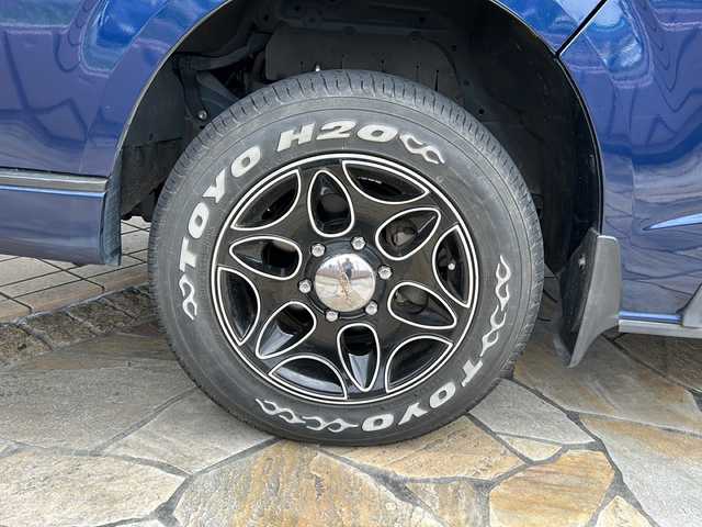 トヨタ ハイエース グランドキャビン 静岡県 2015(平27)年 2.3万km ダークブルーマイカM 社外ナビ(イクリプス)/・TV/・FM/AM/・Bluetooth/・CD/DVD/・SD/・USB/主要装備/・ＭＧＲベッドキット/・後付けハンガーラック/・後付けリアオートエアコン/・TOYOホワイトレタータイヤ/・１６インチ社外ＡＷ/・片側パワスラ/・ＬＥＤヘッドライト/・１００V電源/・フォグランプ/・ソケット電源増設/・LEDヘッドライト/・フォグランプ/・オートエアコン/・ETC/・フローリング調フロアマット