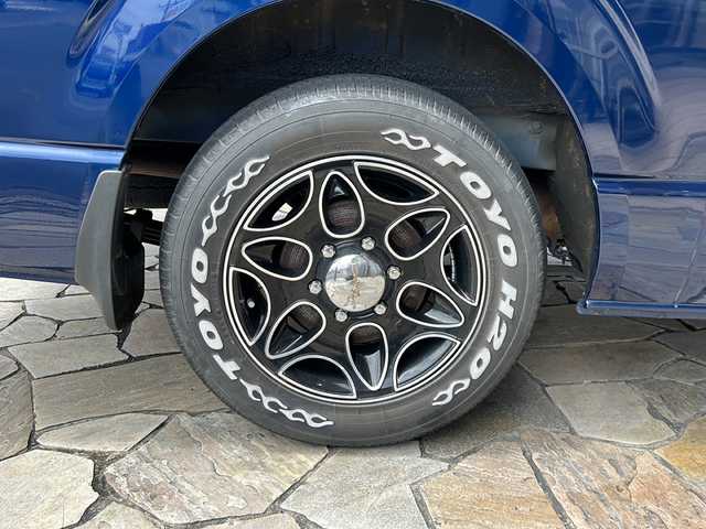 トヨタ ハイエース グランドキャビン 静岡県 2015(平27)年 2.3万km ダークブルーマイカM 社外ナビ(イクリプス)/・TV/・FM/AM/・Bluetooth/・CD/DVD/・SD/・USB/主要装備/・ＭＧＲベッドキット/・後付けハンガーラック/・後付けリアオートエアコン/・TOYOホワイトレタータイヤ/・１６インチ社外ＡＷ/・片側パワスラ/・ＬＥＤヘッドライト/・１００V電源/・フォグランプ/・ソケット電源増設/・LEDヘッドライト/・フォグランプ/・オートエアコン/・ETC/・フローリング調フロアマット