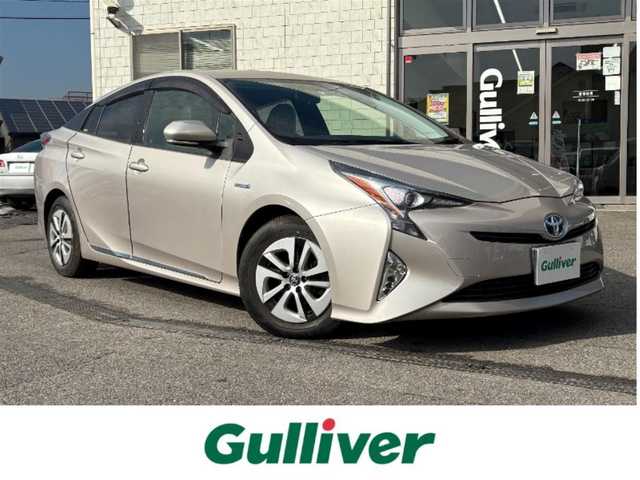 トヨタ プリウス S 千葉県 2016(平28)年 1.6万km スティールブロンドM ワンオーナー/純正９インチSDナビ(フルセグ/BT/AM/FM)/ETC/トノカバー/純正ラゲージマット/純正フロアマット/ABS/横滑り防止装置/盗難防止装置/オートライト/ドアバイザー/電動格納式ミラー/パワーステアリング/パワーウィンドウ/純正アルミホイール/保証書/取扱説明書/スマートキー/スペアキー