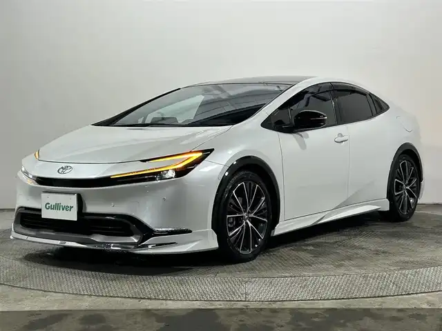 トヨタ プリウス Z 大阪府 2024(令6)年 1.1万km プラチナホワイトパールマイカ 純正ナビ/衝突軽減/全方位カメラ/バックカメラ/ETC/サンルーフ/モデリスタエアロ/シートヒーター/レーダクルコン/コーナーセンサー/革シート/バックカメラ/パワーシート/レーンアシスト/LEDヘッドライト/電動リアゲート/プッシュスタート/スマートキー/オートライト/オートエアコン/電動ミラー/エアシート/ハンドルヒーター/LEDフォグランプ/純正アルミホイール
