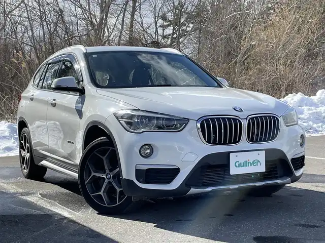 ＢＭＷ Ｘ１ 青森県 2017(平29)年 8.5万km アルピンホワイトⅢ 衝突軽減ブレーキ/LKA/Pアシスト/Bカメラ/純正HDDナビ/BT/DVD/純正18インチAW