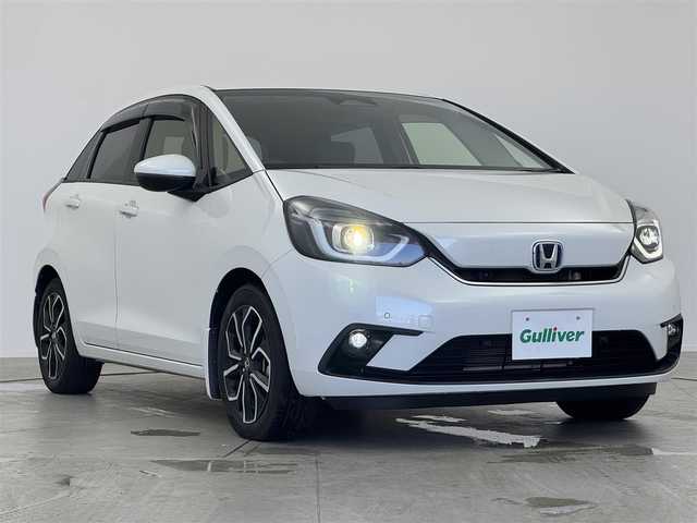 ホンダ フィット e:HEVネス 愛知県 2020(令2)年 2.2万km プラチナホワイトパール 純正ナビ/・CD/DVD/・FM/AM/・フルセグTV/・Music Rack/・SD/・USB/・Bluetooth/主要装備/・バックカメラ/・ＬＥＤヘッドライト/・前後ドライブレコーダー/・ホンダセンシング（安全運転支援）/・電動パーキング/・サイド＋カーテンエアバッグ/・１６インチ純正ＡＷ/・コーナーセンサー/・横滑り防止装置/・レーダークルコン/・ETC