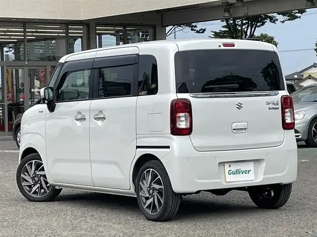 スズキ ワゴンＲ スマイル HYBRID X 宮城県 2023(令5)年 1.6万km ピュアホワイトP /4WD//純正9インチメモリナビ//CD/DVD/BT/HDMI/フルセグテレビ//AppleCarPlay/AndroidAuto//両側パワースライドドア//シートヒーターDN席//ヘッドアップディスプレイ//ビルトインETC//op純正15インチアルミホイール//純正フロアマット//デュアルカメラブレーキサポート//アラウンドビューモニター//レーントレーシングアシスト//レーダークルーズコントロール//パーキングセンサー//アイドリングストップ//スマートキーx2//社外14インチアルミスタッドレスタイヤ積込（2022年製）