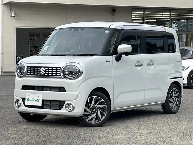 スズキ ワゴンＲ スマイル HYBRID X 宮城県 2023(令5)年 1.6万km ピュアホワイトP /4WD//純正9インチメモリナビ//CD/DVD/BT/HDMI/フルセグテレビ//AppleCarPlay/AndroidAuto//両側パワースライドドア//シートヒーターDN席//ヘッドアップディスプレイ//ビルトインETC//op純正15インチアルミホイール//純正フロアマット//デュアルカメラブレーキサポート//アラウンドビューモニター//レーントレーシングアシスト//レーダークルーズコントロール//パーキングセンサー//アイドリングストップ//スマートキーx2//社外14インチアルミスタッドレスタイヤ積込（2022年製）