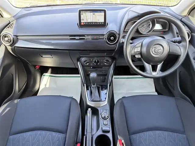 マツダ デミオ XD 岩手県 2015(平27)年 5.3万km ブルーリフレックスマイカ 禁煙車/ディーゼル/純正ナビ/→フルセグTV/Bluetooth/CD/DVD/FM/AM/ステアリングスイッチ/横滑り防止装置/〇プッシュスタート/〇電動格納ミラー/〇スマートキー/〇シガーソケット/トノカバー/USBポート