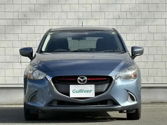 マツダ デミオ XD 岩手県 2015(平27)年 5.3万km ブルーリフレックスマイカ 禁煙車/ディーゼル/純正ナビ/→フルセグTV/Bluetooth/CD/DVD/FM/AM/ステアリングスイッチ/横滑り防止装置/〇プッシュスタート/〇電動格納ミラー/〇スマートキー/〇シガーソケット/トノカバー/USBポート