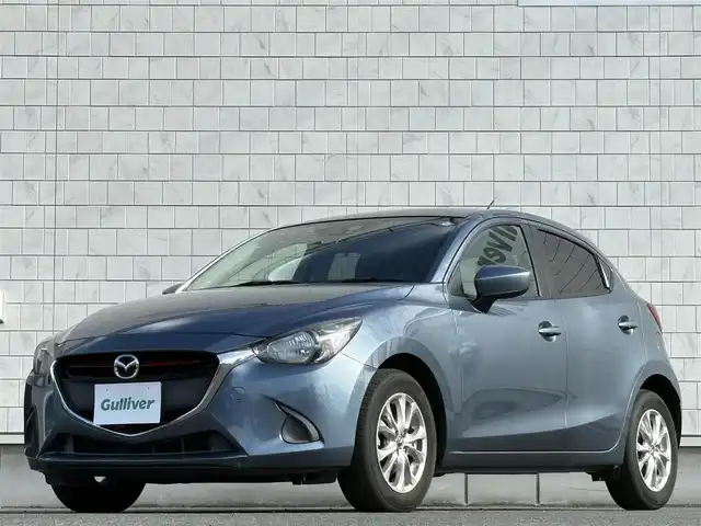 マツダ デミオ XD 岩手県 2015(平27)年 5.3万km ブルーリフレックスマイカ 禁煙車/ディーゼル/純正ナビ/→フルセグTV/Bluetooth/CD/DVD/FM/AM/ステアリングスイッチ/横滑り防止装置/〇プッシュスタート/〇電動格納ミラー/〇スマートキー/〇シガーソケット/トノカバー/USBポート