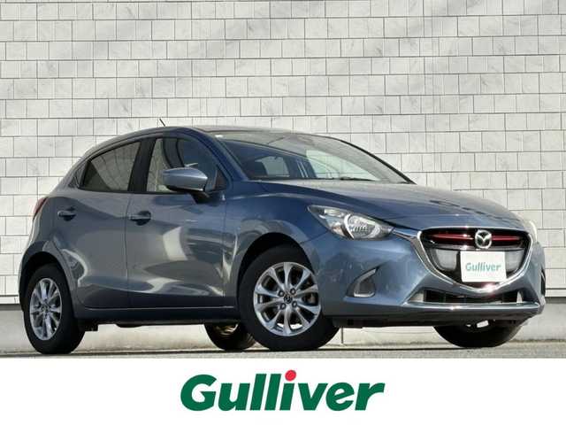 マツダ デミオ XD 千葉県 2015(平27)年 5.3万km ブルーリフレックスマイカ 禁煙車/ディーゼル/純正ナビ/→フルセグTV/Bluetooth/CD/DVD/FM/AM/ステアリングスイッチ/横滑り防止装置/〇プッシュスタート/〇電動格納ミラー/〇スマートキー/〇シガーソケット/トノカバー/USBポート