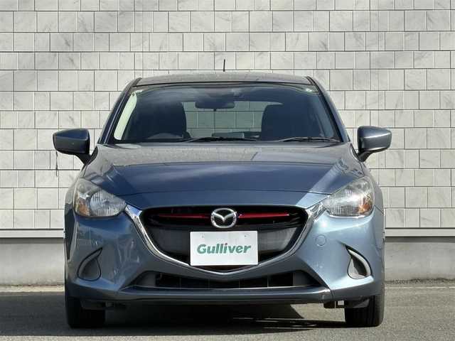 マツダ デミオ XD 千葉県 2015(平27)年 5.3万km ブルーリフレックスマイカ 禁煙車/ディーゼル/純正ナビ/→フルセグTV/Bluetooth/CD/DVD/FM/AM/ステアリングスイッチ/横滑り防止装置/〇プッシュスタート/〇電動格納ミラー/〇スマートキー/〇シガーソケット/トノカバー/USBポート