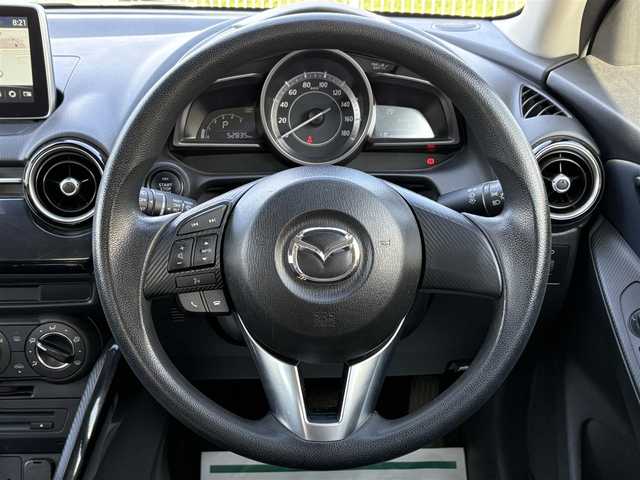 マツダ デミオ XD 千葉県 2015(平27)年 5.3万km ブルーリフレックスマイカ 禁煙車/ディーゼル/純正ナビ/→フルセグTV/Bluetooth/CD/DVD/FM/AM/ステアリングスイッチ/横滑り防止装置/〇プッシュスタート/〇電動格納ミラー/〇スマートキー/〇シガーソケット/トノカバー/USBポート