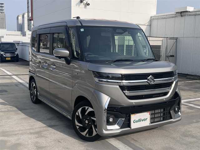 スズキ スペーシア カスタム HYBRID XS ターボ 広島県 2024(令6)年 0.7万km スチールシルバーM ワンオーナー/純正メーカーオプション9インチナビ/・スズキコネクト/・フルセグTV/・Bluetooth/・全方位&バックカメラ/スズキセーフティーサポート/・デュアルセンサーブレーキサポート2/・誤発進抑制機能（前後）/・アダプティブクルーズコントロール/・車線逸脱警報&抑制機能/・車線維持支援機能/・ふらつきお知らせ機能/・標識認識機能/・ハイビームアシスト/コーナーセンサー/両側パワースライドドア/フルLEDヘッドライト/ハーフレザー調シート/・シートヒーター（D/N席）/ドライブレコーダー/ビルトインETC