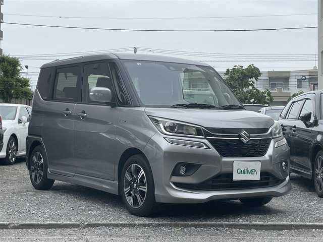 スズキ ソリオ バンディット HV MV 東京都 2018(平30)年 1.1万km プレミアムシルバーメタリック 登録時走行距離10765km/ワンオーナー/社外メモリナビ/（DVD/フルセグTV/Bluetooth/MSV）/バックカメラ/ビルトインETC/両側パワースライドドア/運転席シートヒーター/リアサイドサンシェード/ステアマチック/スズキセーフティサポート/・アダプティブクルーズコントロール/・デュアルカメラブレーキサポート/・先行車発進お知らせ機能/・誤発進抑制機能/・後方誤発進抑制機能/・車線逸脱抑制機能/純正15インチアルミホイール/純正LEDヘッドライト/スマートキー/スペアキー1本/保証書/取扱説明書