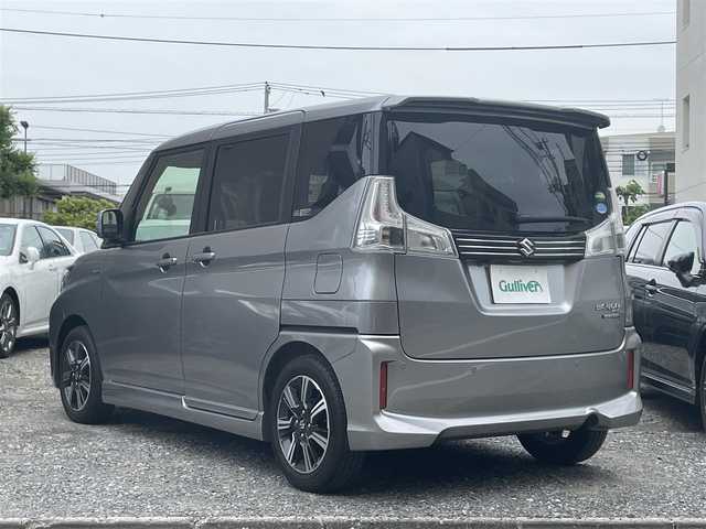 スズキ ソリオ バンディット HV MV 東京都 2018(平30)年 1.1万km プレミアムシルバーメタリック 登録時走行距離10765km/ワンオーナー/社外メモリナビ/（DVD/フルセグTV/Bluetooth/MSV）/バックカメラ/ビルトインETC/両側パワースライドドア/運転席シートヒーター/リアサイドサンシェード/ステアマチック/スズキセーフティサポート/・アダプティブクルーズコントロール/・デュアルカメラブレーキサポート/・先行車発進お知らせ機能/・誤発進抑制機能/・後方誤発進抑制機能/・車線逸脱抑制機能/純正15インチアルミホイール/純正LEDヘッドライト/スマートキー/スペアキー1本/保証書/取扱説明書
