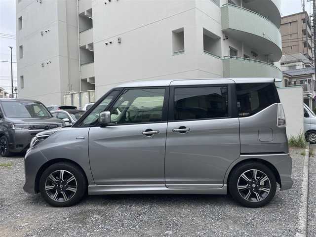 スズキ ソリオ バンディット HV MV 東京都 2018(平30)年 1.1万km プレミアムシルバーメタリック 登録時走行距離10765km/ワンオーナー/社外メモリナビ/（DVD/フルセグTV/Bluetooth/MSV）/バックカメラ/ビルトインETC/両側パワースライドドア/運転席シートヒーター/リアサイドサンシェード/ステアマチック/スズキセーフティサポート/・アダプティブクルーズコントロール/・デュアルカメラブレーキサポート/・先行車発進お知らせ機能/・誤発進抑制機能/・後方誤発進抑制機能/・車線逸脱抑制機能/純正15インチアルミホイール/純正LEDヘッドライト/スマートキー/スペアキー1本/保証書/取扱説明書