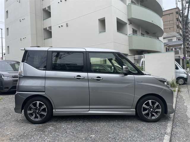 スズキ ソリオ バンディット HV MV 東京都 2018(平30)年 1.1万km プレミアムシルバーメタリック 登録時走行距離10765km/ワンオーナー/社外メモリナビ/（DVD/フルセグTV/Bluetooth/MSV）/バックカメラ/ビルトインETC/両側パワースライドドア/運転席シートヒーター/リアサイドサンシェード/ステアマチック/スズキセーフティサポート/・アダプティブクルーズコントロール/・デュアルカメラブレーキサポート/・先行車発進お知らせ機能/・誤発進抑制機能/・後方誤発進抑制機能/・車線逸脱抑制機能/純正15インチアルミホイール/純正LEDヘッドライト/スマートキー/スペアキー1本/保証書/取扱説明書